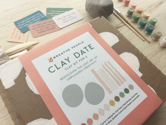 Clay date kit photo with tools, paint and prompts to create connection and creativity. 